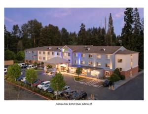 an aerial view of a hotel with a parking lot at Holiday Inn Express Bothell, an IHG Hotel in Bothell