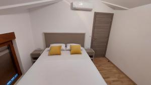 Ένα ή περισσότερα κρεβάτια σε δωμάτιο στο Apartman Bajo