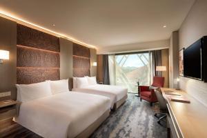 Hilton Port Moresby Hotel & Residences客房内的一张或多张床位