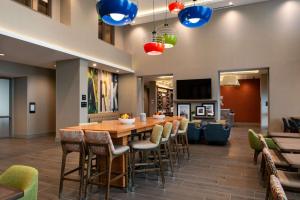 a dining room with a table and chairs at Hampton Inn & Suites Buena Park in Buena Park