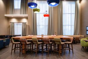 a conference room with a large wooden table and chairs at Hampton Inn & Suites Buena Park in Buena Park