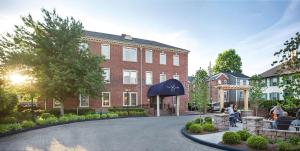 a brick building with a black awning in front of it at The Sire Hotel Lexington, Tapestry Collection by Hilton in Lexington