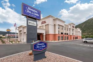 a sign for a hotel in front of a building at Hampton Inn & Suites Ruidoso Downs in Ruidoso Downs