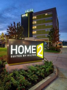 a sign for a home suites by hilton at Home2 Suites By Hilton Oklahoma City Nw Expressway in Oklahoma City