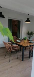 a dining room with a wooden table and chairs at Rustic in Vir +26 photos
