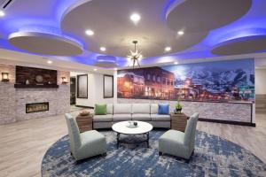 a lobby with a couch and chairs and a fireplace at Homewood Suites By Hilton Steamboat Springs in Steamboat Springs
