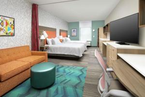 Home2 Suites by Hilton Lakeland South Polk Parkway的电视和/或娱乐中心
