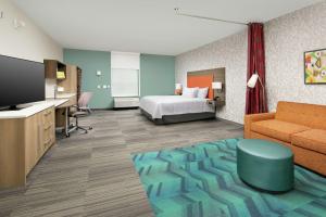 Home2 Suites by Hilton Lakeland South Polk Parkway客房内的一张或多张床位
