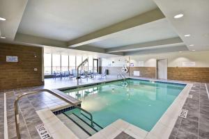 a large swimming pool in a building at Hilton Garden Inn Gastonia in Gastonia