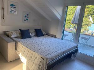 Postel nebo postele na pokoji v ubytování DIANO Design&Suite Jeans