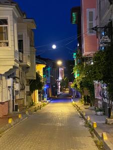 a cobblestone street at night in a city at 3 Floor Oldcity in Istanbul