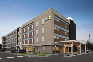 a rendering of a hotel with a building at Home2 Suites By Hilton Brooklyn Park Minneapolis in Brooklyn Park