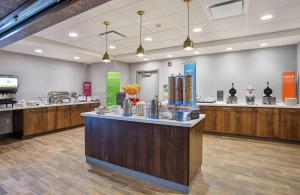 a large room with a counter in a store at Hampton Inn Simpsonville in Simpsonville