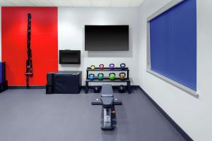 a room with a blue and red wall at Tru By Hilton Gilbert in Gilbert