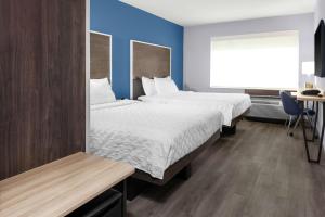 Postel nebo postele na pokoji v ubytování Tru By Hilton Gilbert + 17 fotografií