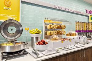 a display case in a store filled with food at Tru Lawrenceville Atlanta I85 Sugarloaf in Lawrenceville