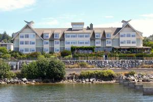 a large building next to a body of water at Chrysalis Inn & Spa Bellingham, Curio Collection by Hilton in Bellingham
