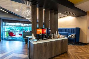 a bar with bottles of wine on a counter at Tru By Hilton Seneca Clemson Sc in Seneca