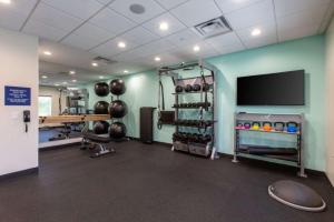 a room with a gym with a flat screen tv at Tru By Hilton Seneca Clemson Sc in Seneca