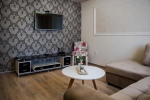 a living room with a couch and a table at Apartment Domenica Medjugorje in Međugorje