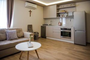 a living room with a couch and a table at Apartment Domenica Medjugorje in Međugorje