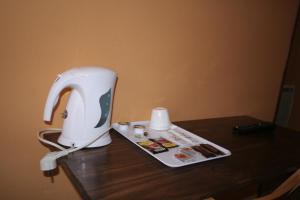 a sewing machine sitting on top of a wooden table at Hostal Juventus in Portbou