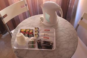 a table with a plate of food and a blender at Hostal Juventus in Portbou
