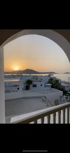 a view of a sunset from a balcony at Anthoula Home Paros in Naousa +20 photos