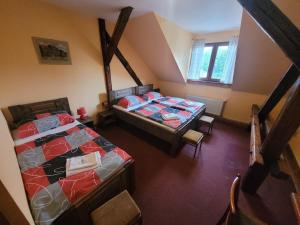 an overhead view of a bedroom with two beds at Hotel Max Šimek in Ostrava