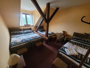 an overhead view of a room with four beds at Hotel Max Šimek in Ostrava