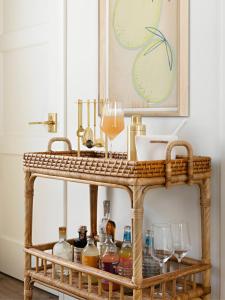 a drink cart with bottles and glasses on it at Farmhouse Paso in Paso Robles