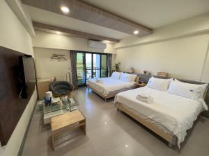 Katil atau katil-katil dalam bilik di Dongjin Bay B&B