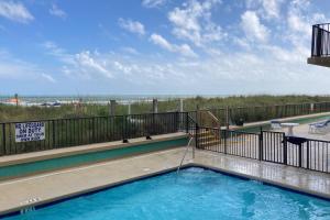 a swimming pool with a view of the beach at Sea Castle A-3 in Myrtle Beach