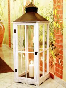 a lantern with a candle inside of it at Hotel La Pigna in Marina di Pietrasanta