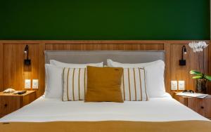 Cama ou camas em um quarto em Pousada Bahia Tambor