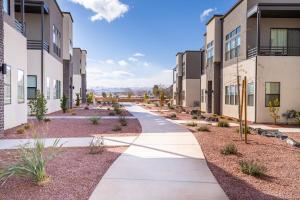 a walkway in front of a building at Villa 27 - 4 Bedroom Townhome! Pool and Hot Tub! in St. George