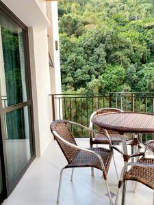 a balcony with two chairs and a table with a view at Apartamento novíssimo Copacabana in Rio de Janeiro
