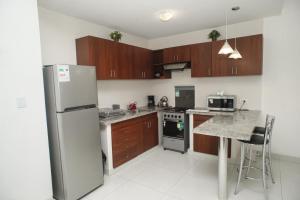 Kuchyň nebo kuchyňský kout v ubytování Downtown Apartments "Altos del Sur"