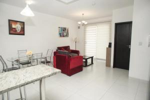 Posezení v ubytování Downtown Apartments "Altos del Sur"