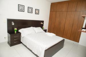 Postel nebo postele na pokoji v ubytování Downtown Apartments "Altos del Sur"