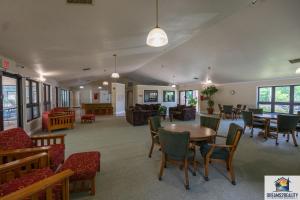 a living room with a table and chairs at 2BR Walk-In Condo - Near the 76 Strip - 2 Pools - FREE TICKETS INCLUDED - FHD-8 in Branson +32 photos