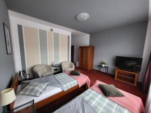 Posteľ alebo postele v izbe v ubytovaní Apartamenty Amadeus