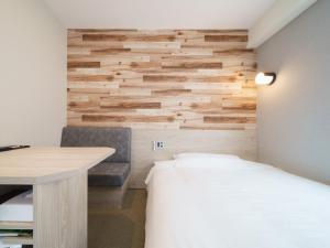 Postel nebo postele na pokoji v ubytování Super Hotel Tokyo JR Kamata Nishiguchi