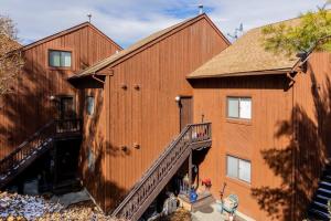 an aerial view of a large wooden building with a staircase at Cozy 2BR condo w/ valley views in Vernon Township