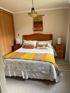 Ένα ή περισσότερα κρεβάτια σε δωμάτιο στο Departamento Condominio Parque del Volcan