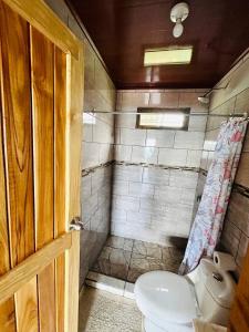 a bathroom with a toilet and a sink at Ocean view in Monteverde Costa Rica