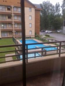 Πισίνα στο ή κοντά στο Departamento Condominio Parque del Volcan