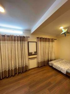 a bedroom with a bed and a star on the ceiling at In the heart of Patan Durbar Square in Pātan