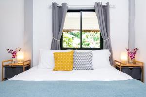 Postel nebo postele na pokoji v ubytování Garden Home 2