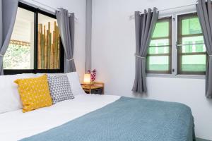 Postel nebo postele na pokoji v ubytování Garden Home 2